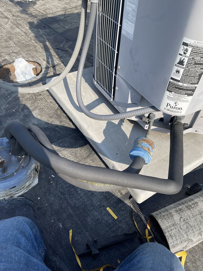 AC refrigerant line and insulation close-up